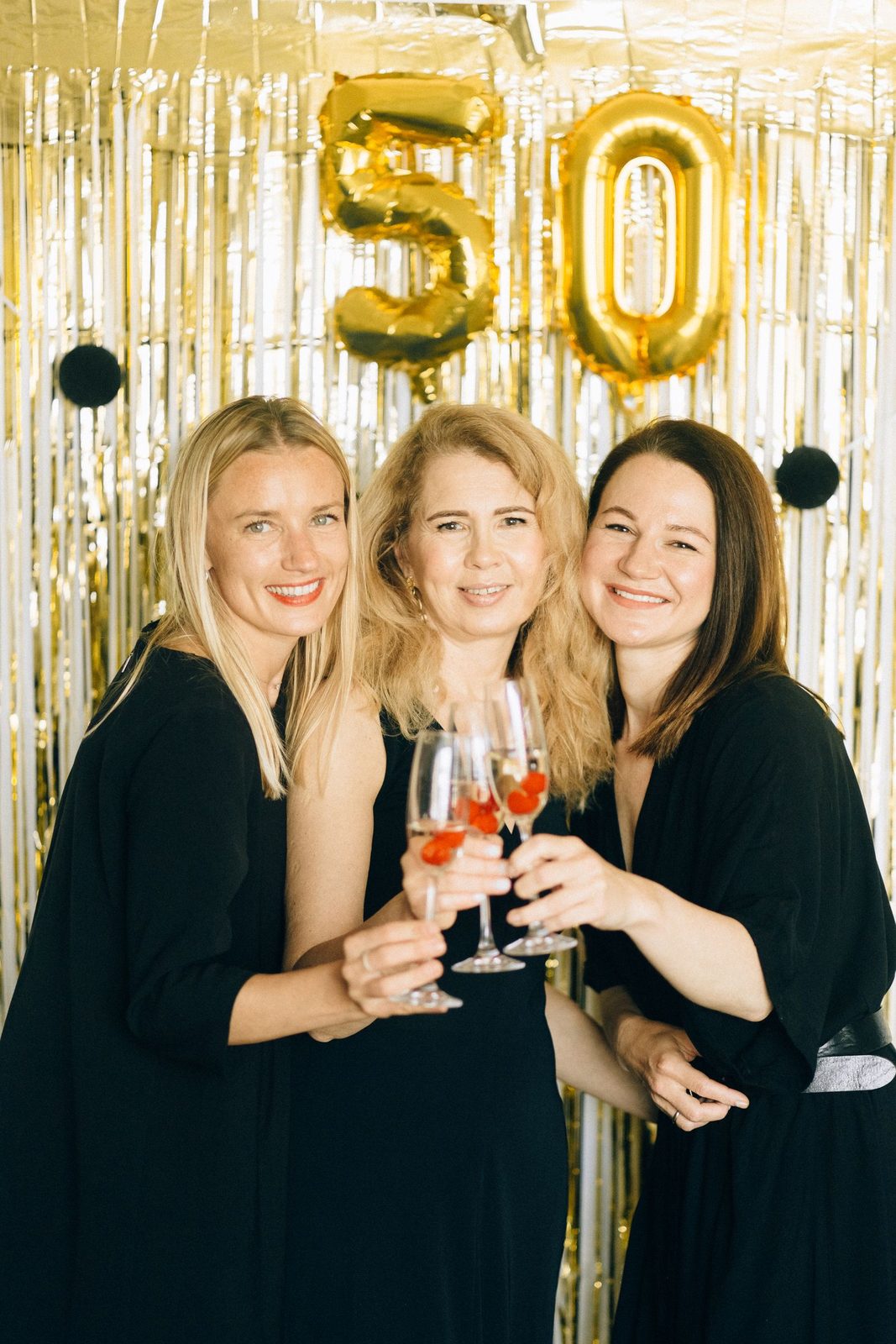 Friends toasting at a milestone birthday celebration