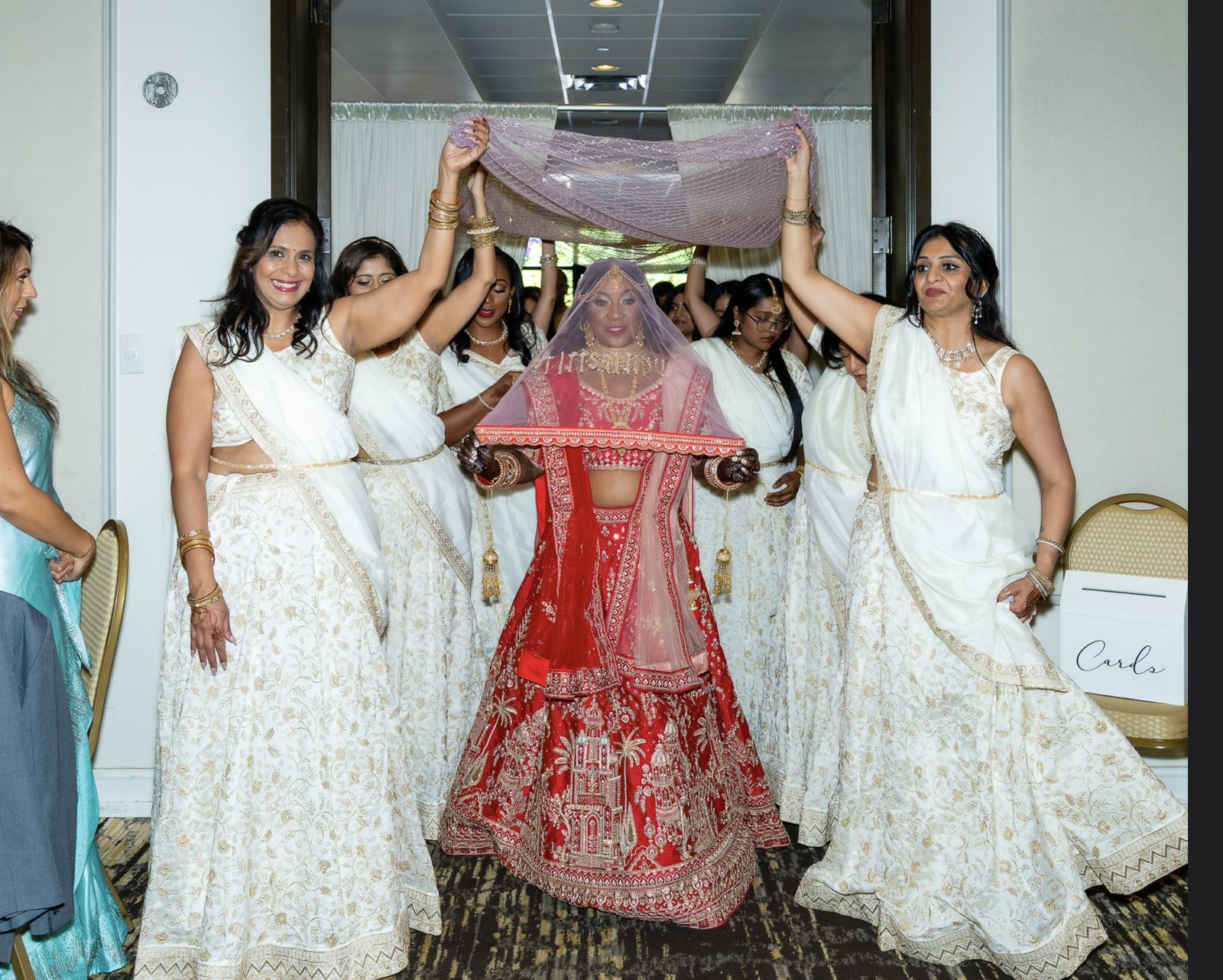 Bride's grand entrance beneath a phoolon ki chadar