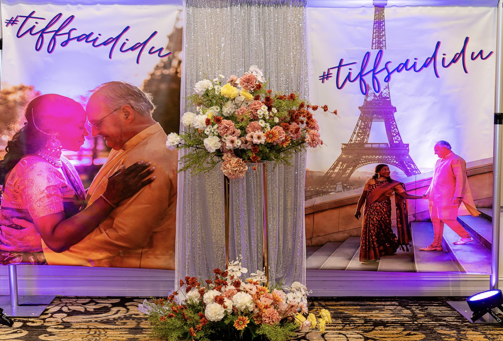 Wedding welcome decor with floral displays and a photo backdrop