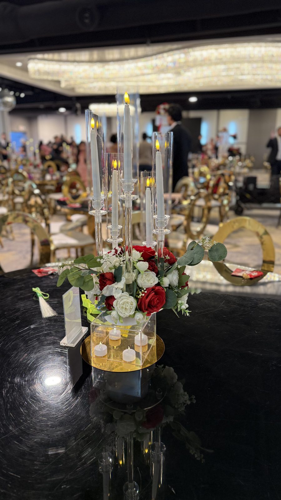 Crystal candelabra and rose centerpiece at a reception