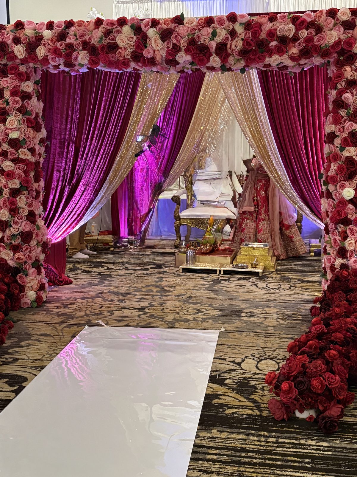 Rose-canopy mandap with magenta and gold drapes